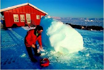 Societies in Arctic and subarctic regions often struggle to find adequate supplies of drinking water. Ice and snow may be the only source of domestic self-supply, as shown by this resident of Quaanaq, Greenland.