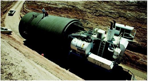 If water planners do not carefully consider current and future water needs for a given area, expansion of local and regional economies may outpace available water supplies; conversely, available water supplies could end up far exceeding local demands. Here a large water-supply pipe is en route to a construction site in the Colorado River Basin.