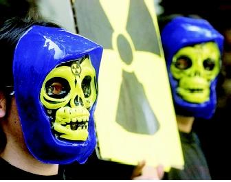 Greenpeace activists protest in 2001 against the imminent sailing of the vessel Pacific Swan. The ship was loaded with a highly radioactive product made of waste material from nuclear reactors. Protestors feared an accident would release large quantities of radioactivity to ocean waters.