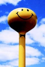 Public water systems use above-ground, elevated, or below-ground storage methods, or a combination of methods. Elevated water towers may become local landmarks, especially if painted whimsically. The "smiley face" tower in Ashley, Indiana enhances civic pride while serving the community's watersupply needs.